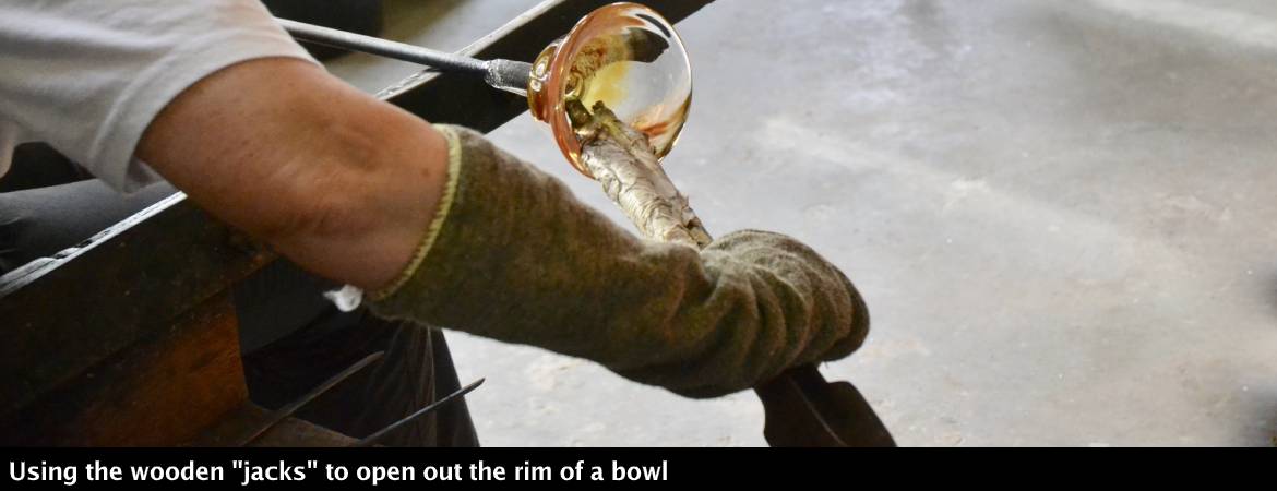 Opening out the rim of a bowl with wooden jacks