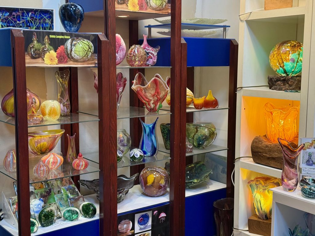 Shelves of Siddy Langley art glass